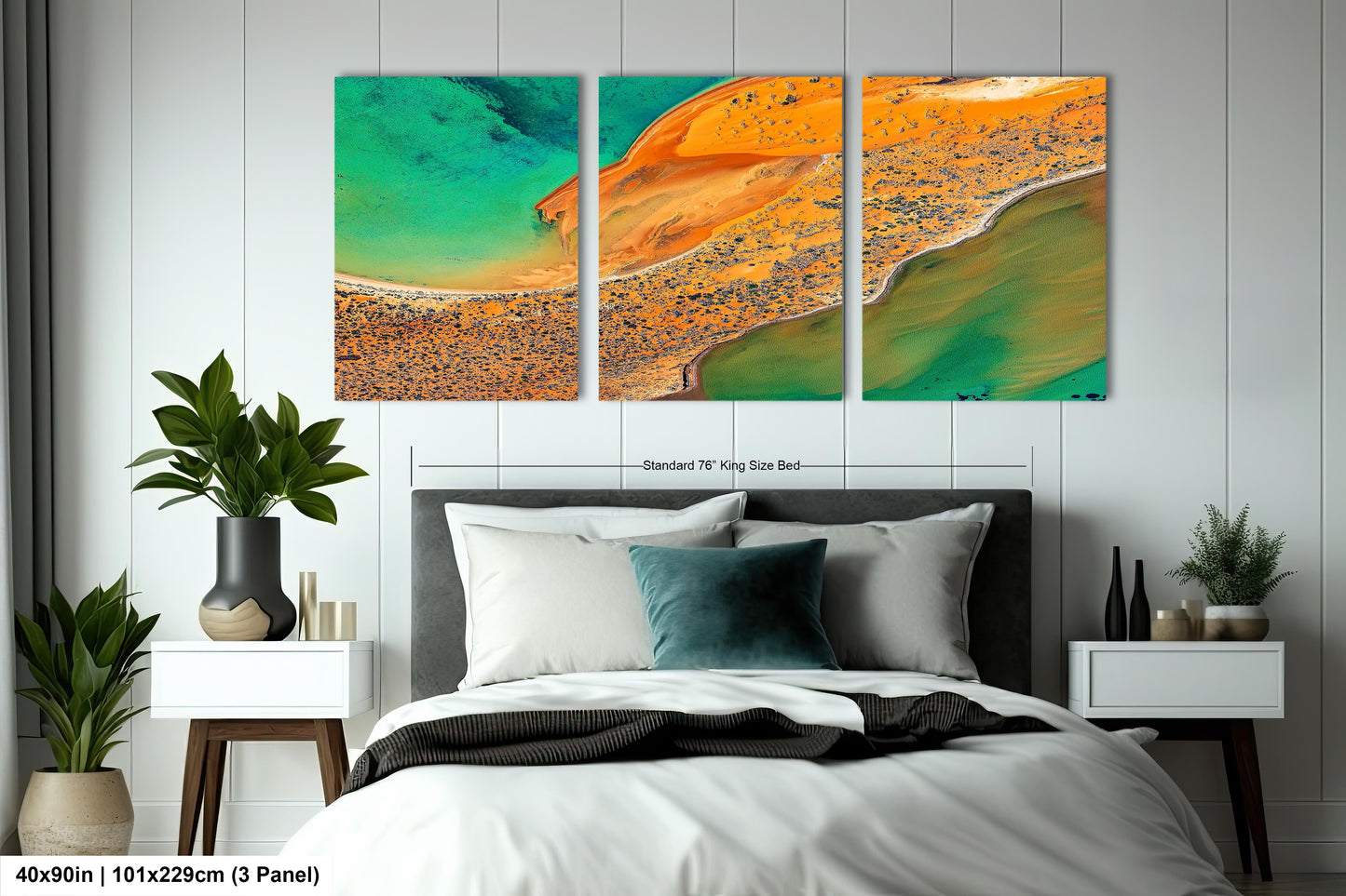 a bedroom with a bed and two paintings on the wall