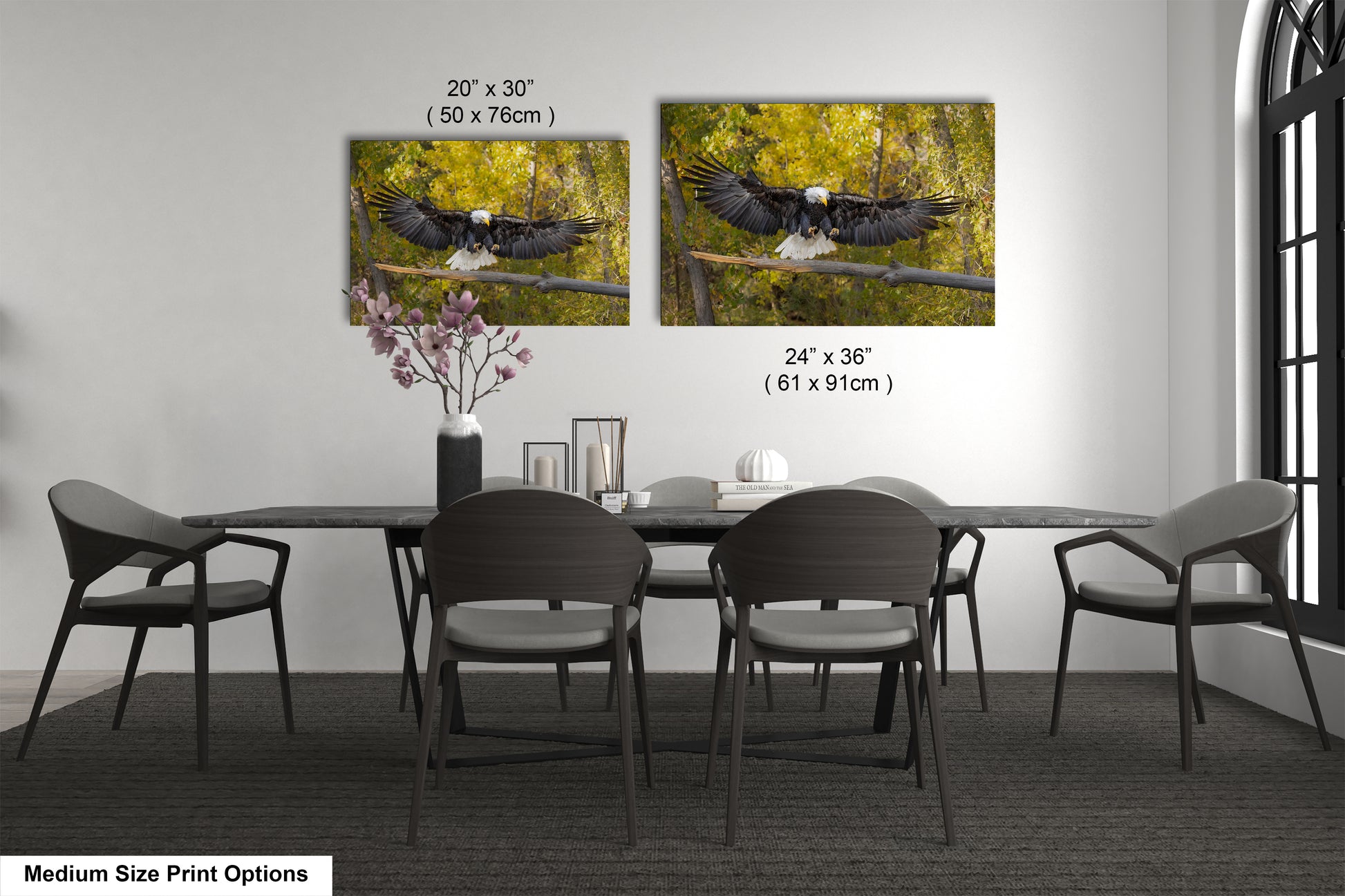 a dining room table with four chairs and two pictures of birds on the wall