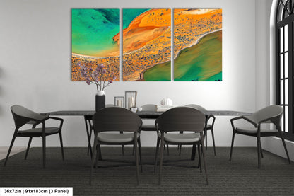 a dining room table with chairs and a painting on the wall