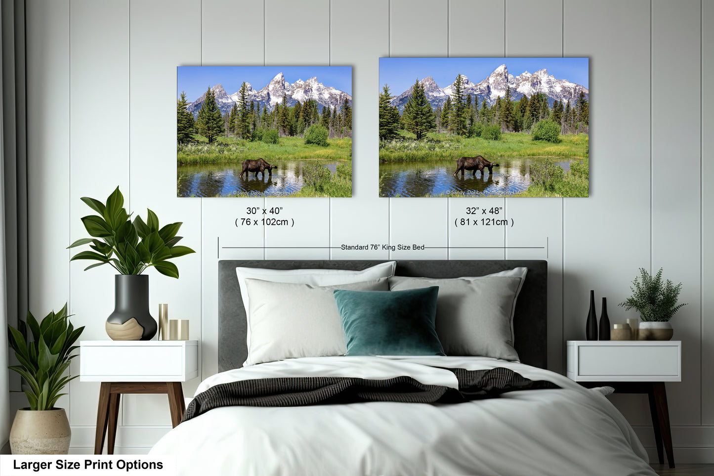 a bedroom with a bed and two pictures on the wall