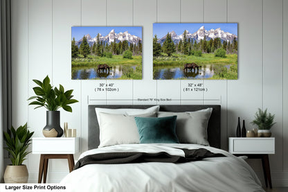 a bedroom with a bed and two pictures on the wall