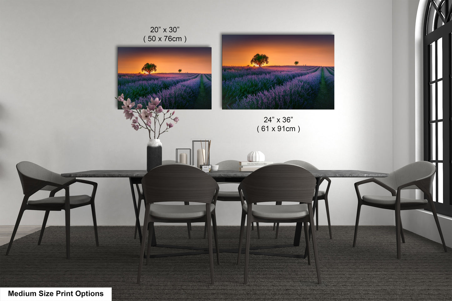 a dining room table with four chairs and a vase of flowers