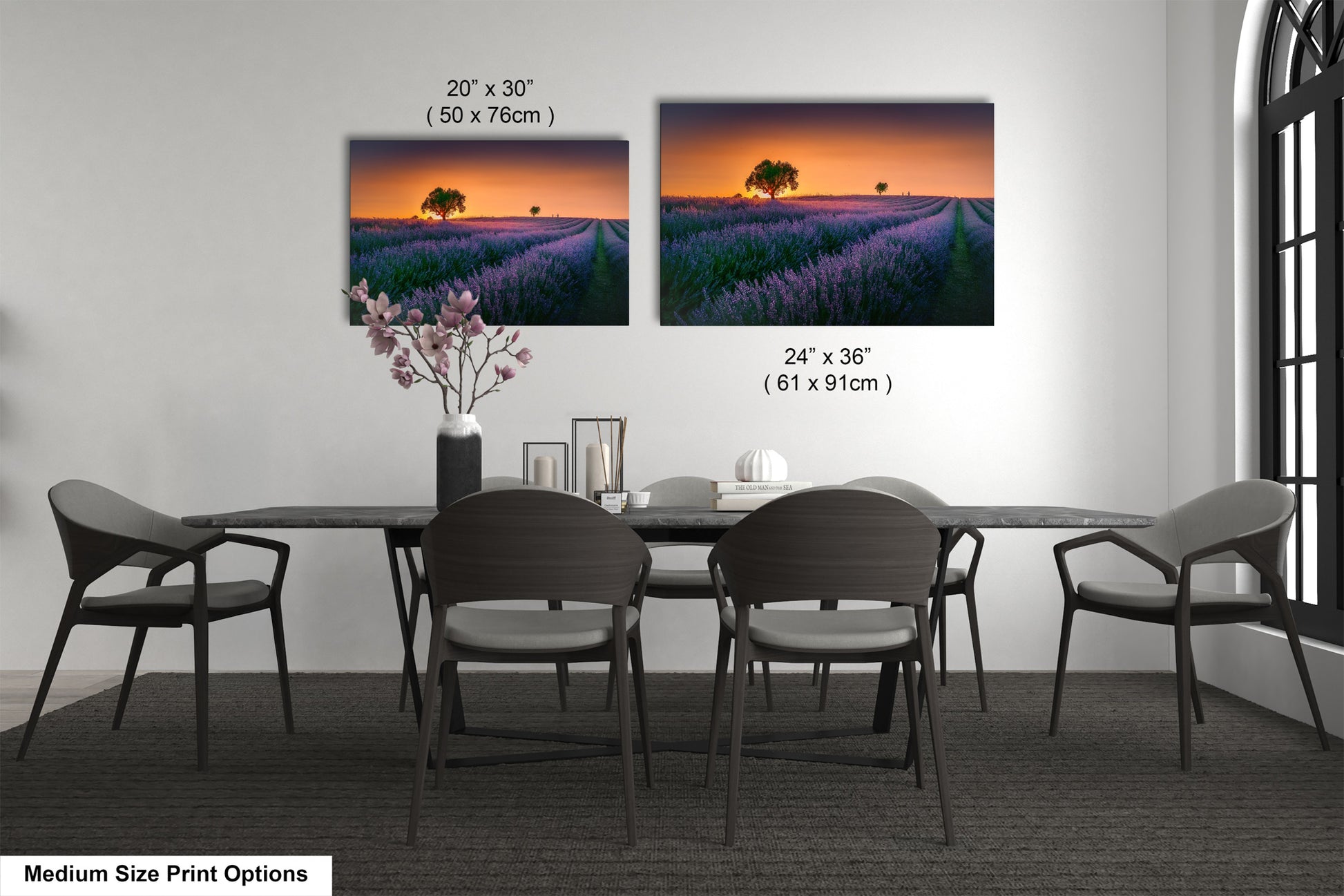 a dining room table with four chairs and a vase of flowers