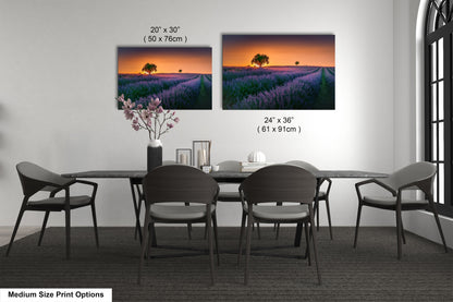 a dining room table with four chairs and a vase of flowers