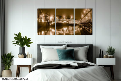 a bed room with a neatly made bed and a painting on the wall
