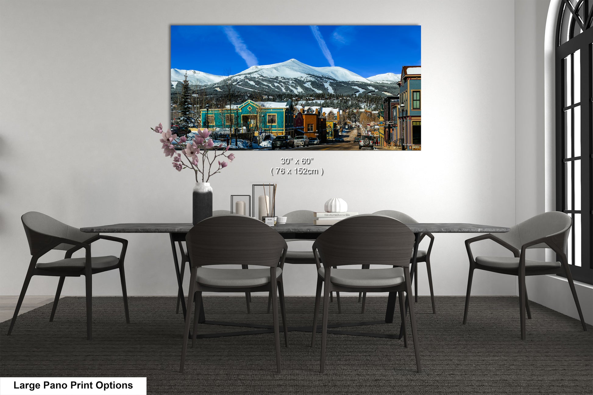 a dining room with a table and chairs