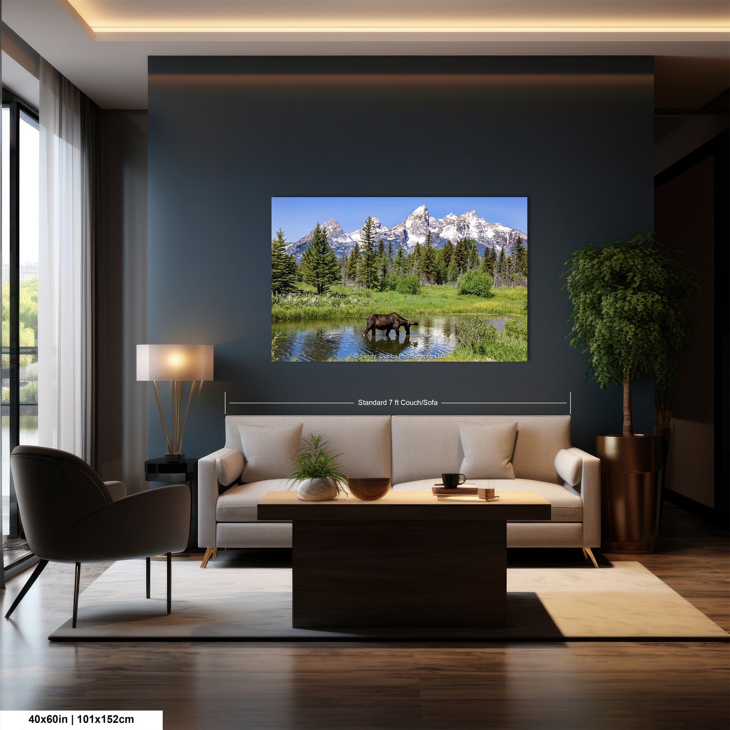 a living room with a couch and a large picture on the wall
