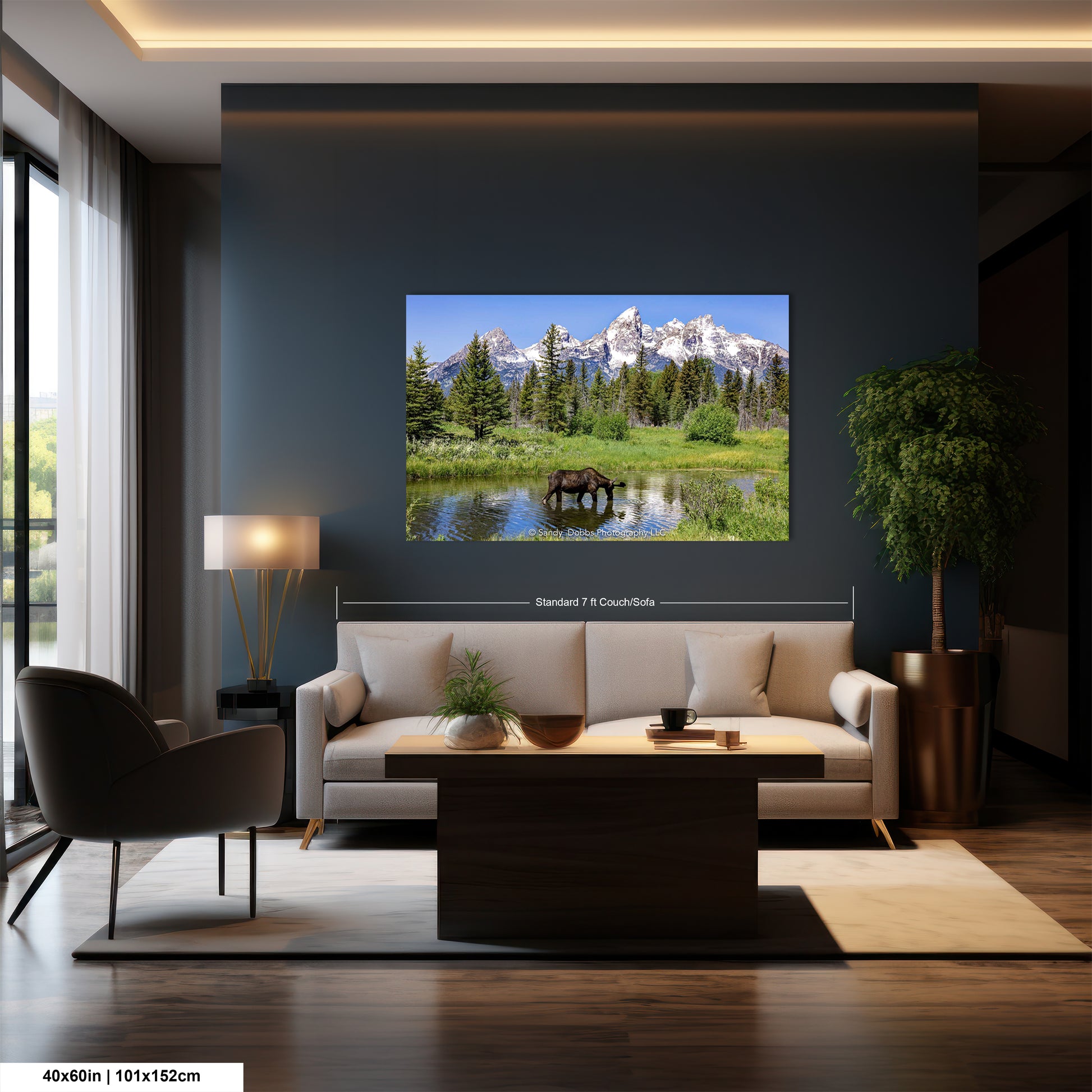 a living room with a couch and a large picture on the wall