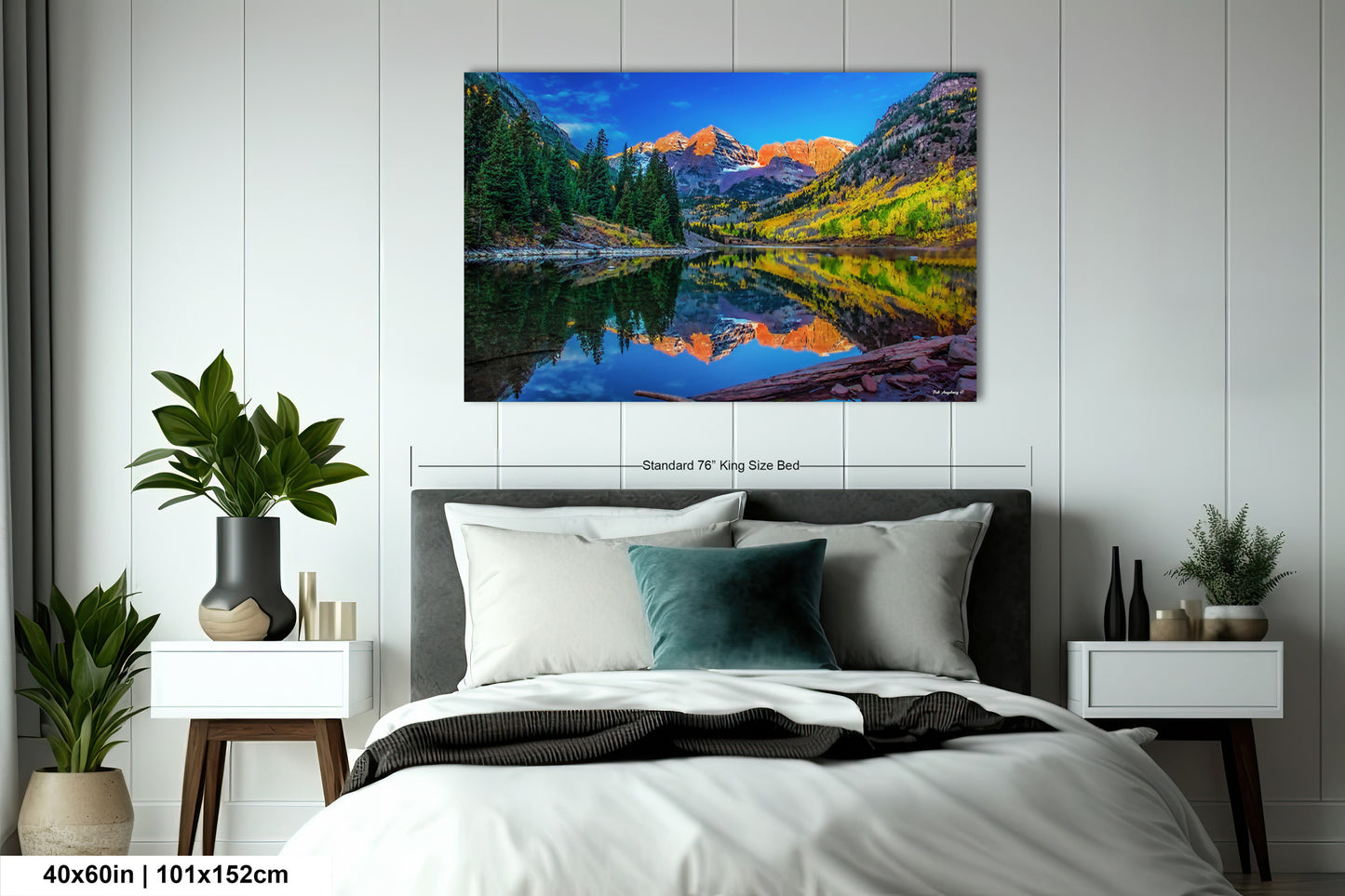 a bedroom with a bed and a painting on the wall