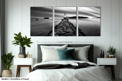 a black and white photo of a bedroom with a bed