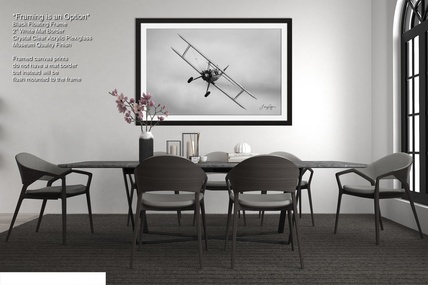 a black and white photo of a dining room