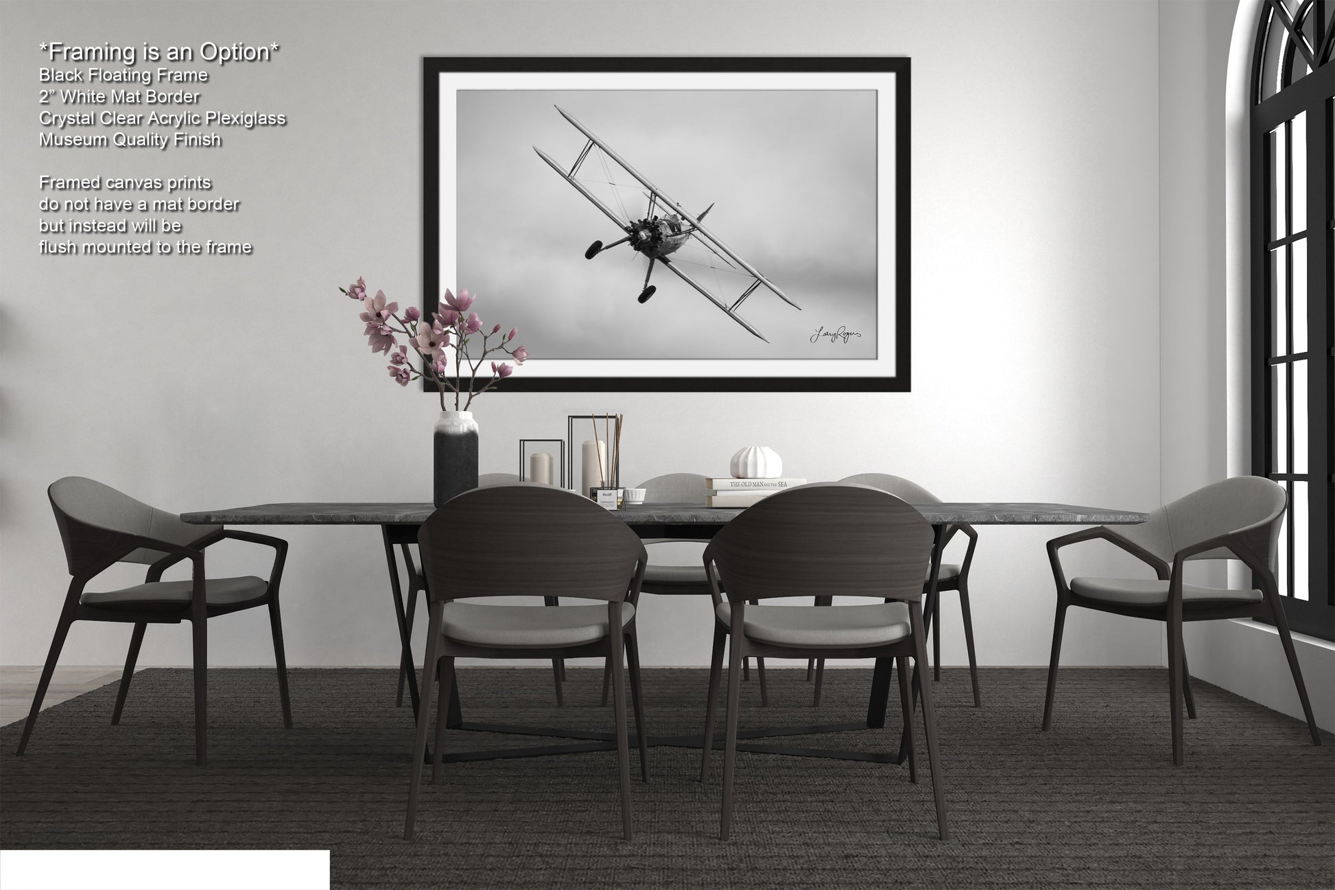 a black and white photo of a dining room