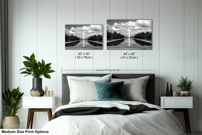 a bed room with a neatly made bed and two pictures on the wall
