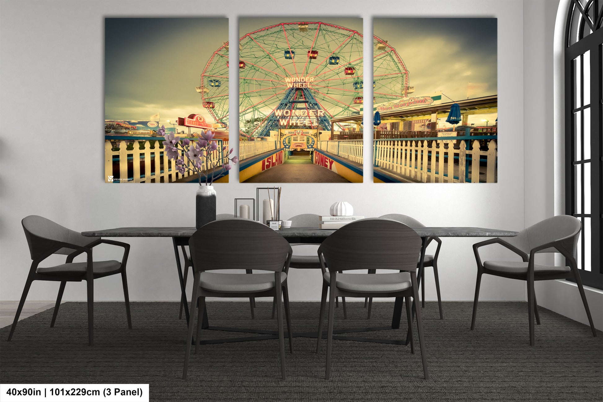 a dining room table with chairs and a ferris wheel in the background