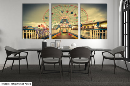 a dining room table with chairs and a ferris wheel in the background