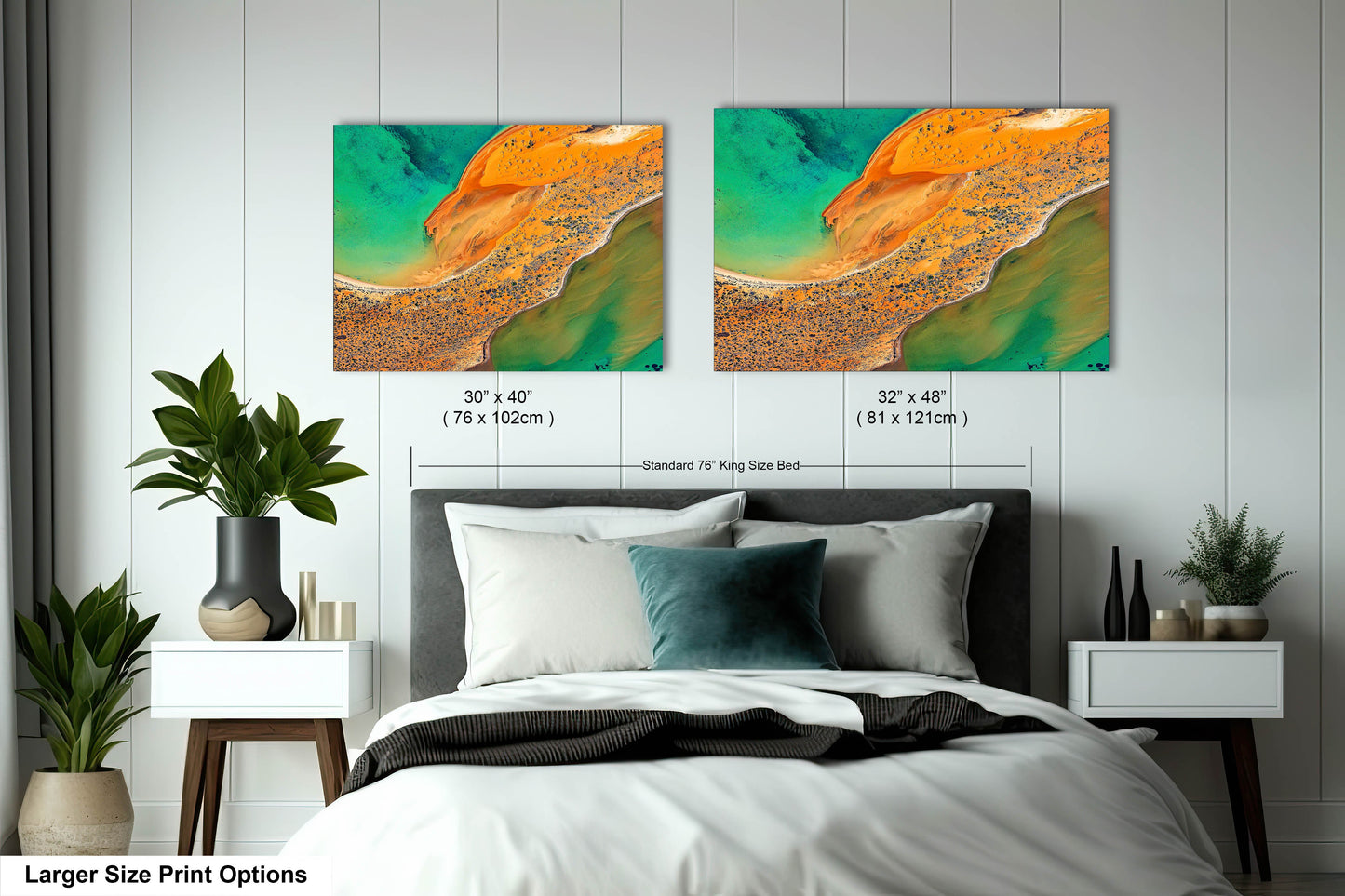 a bed with two paintings on the wall above it