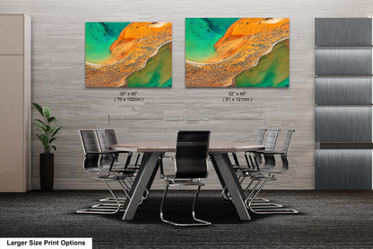 a dining room table with chairs and a painting on the wall