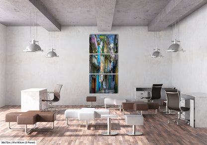 a room with a lot of chairs and a painting on the wall