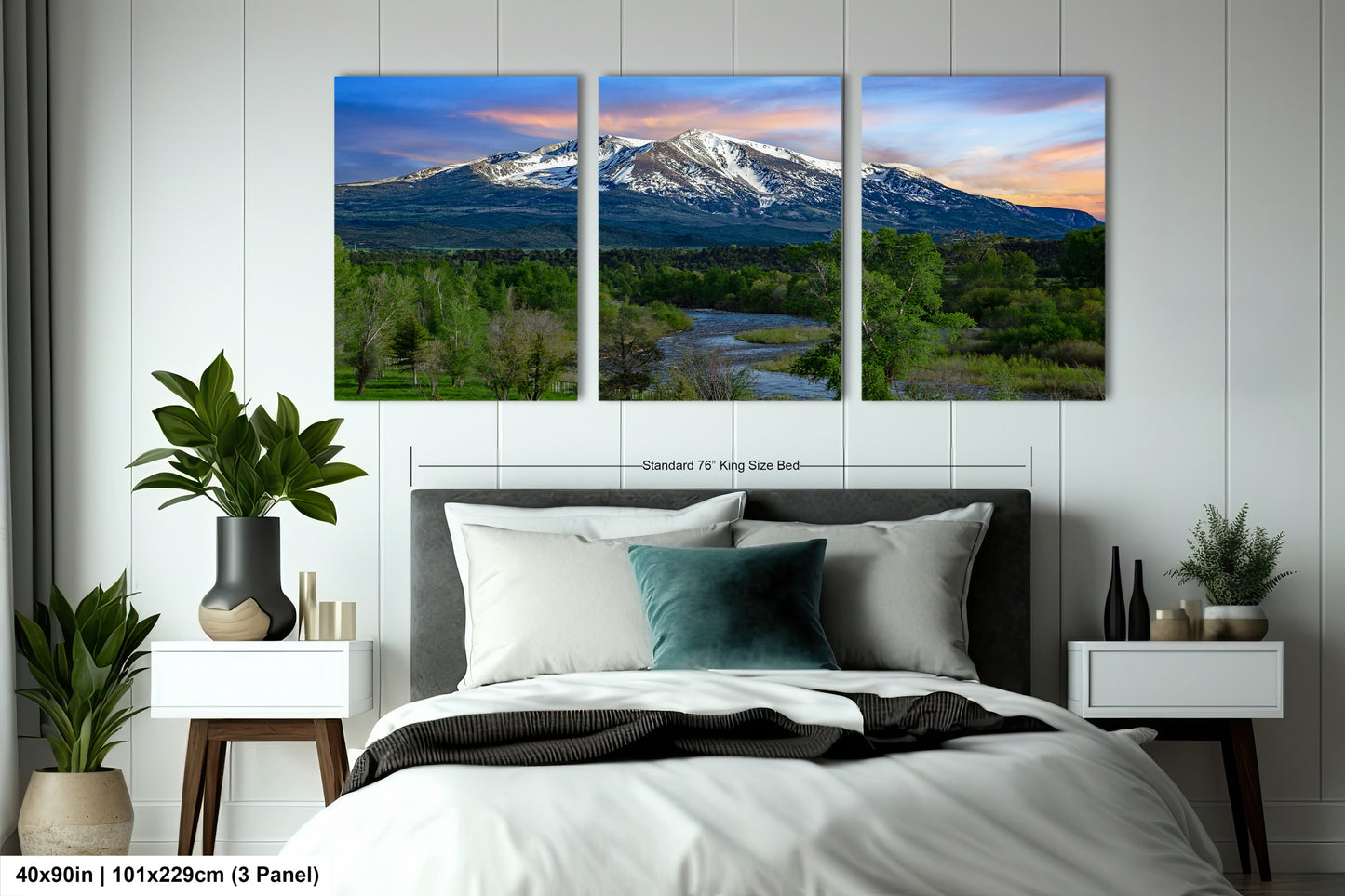 a bedroom scene with a bed and two paintings on the wall