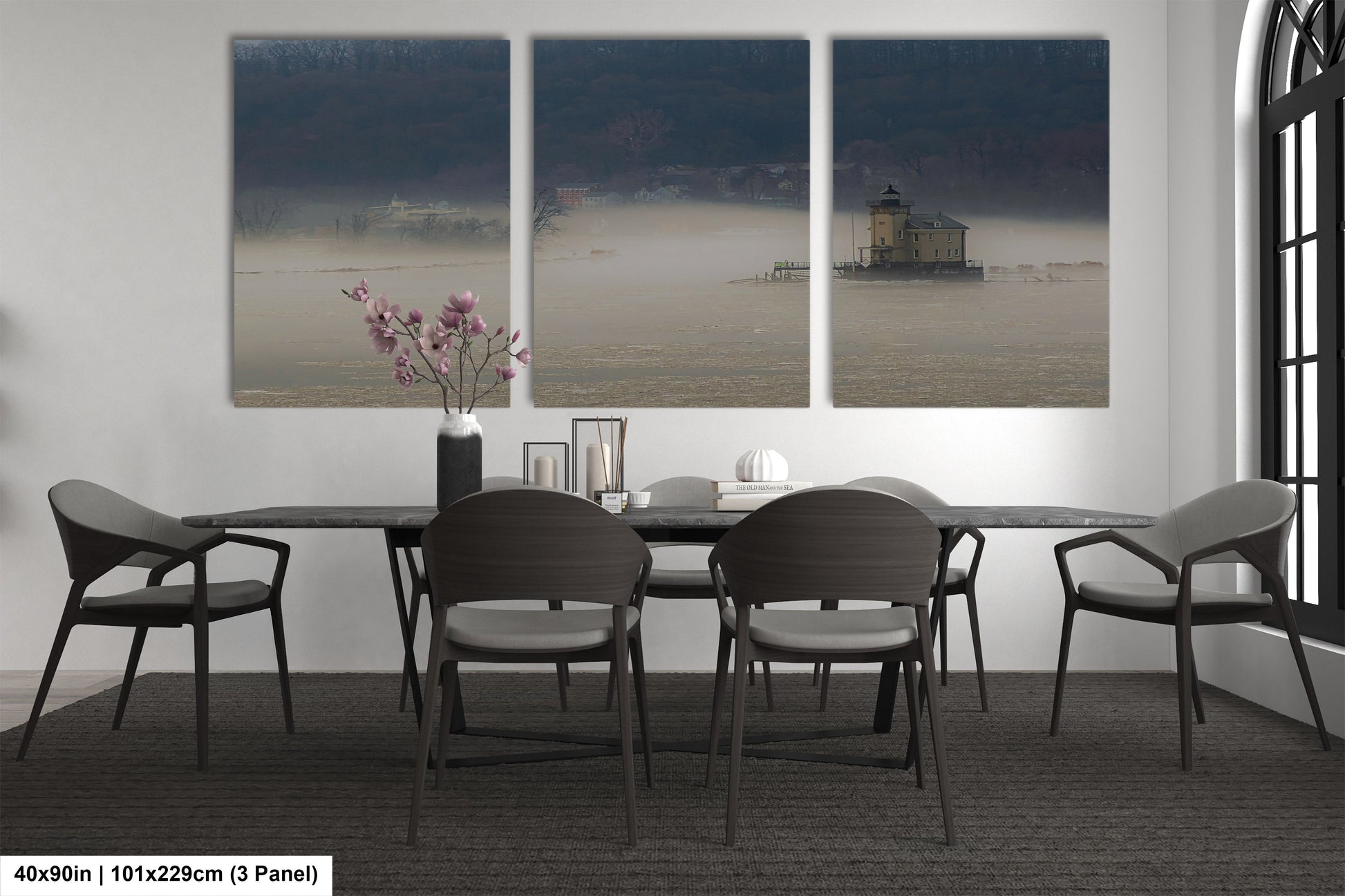 a dining table with four chairs and a vase of flowers