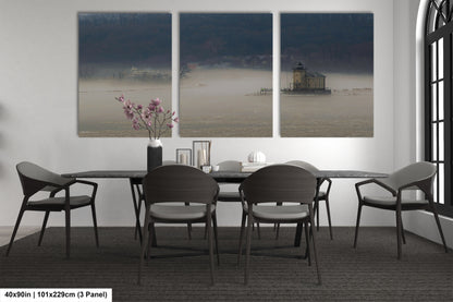 a dining table with four chairs and a vase of flowers