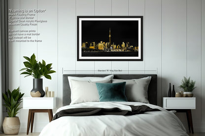 a picture of a city at night taken from the bed
