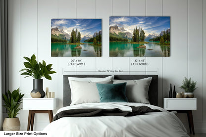 a bedroom with a bed and two pictures on the wall