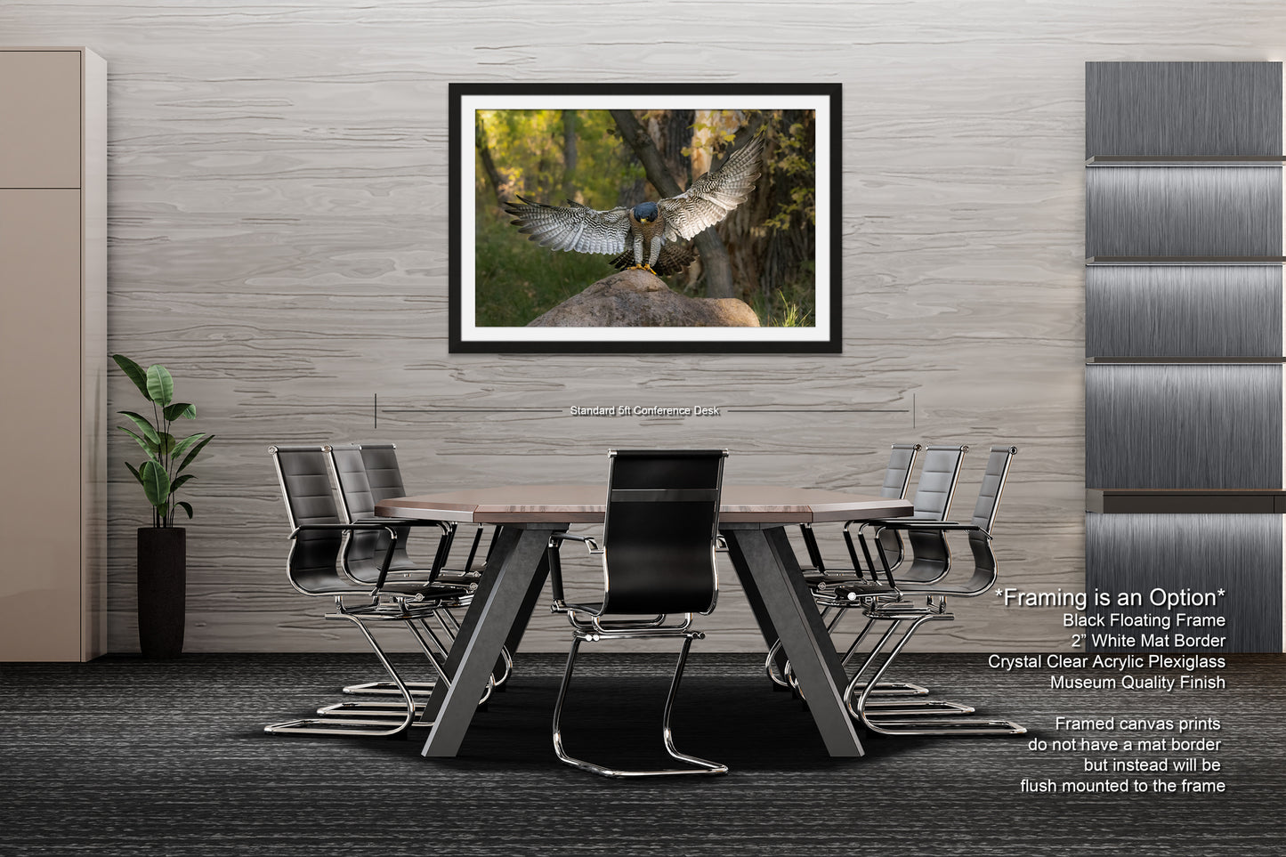 a modern office space with a large framed photograph of a bird in flight hanging on the wall above a wooden table surrounded by black chairs.