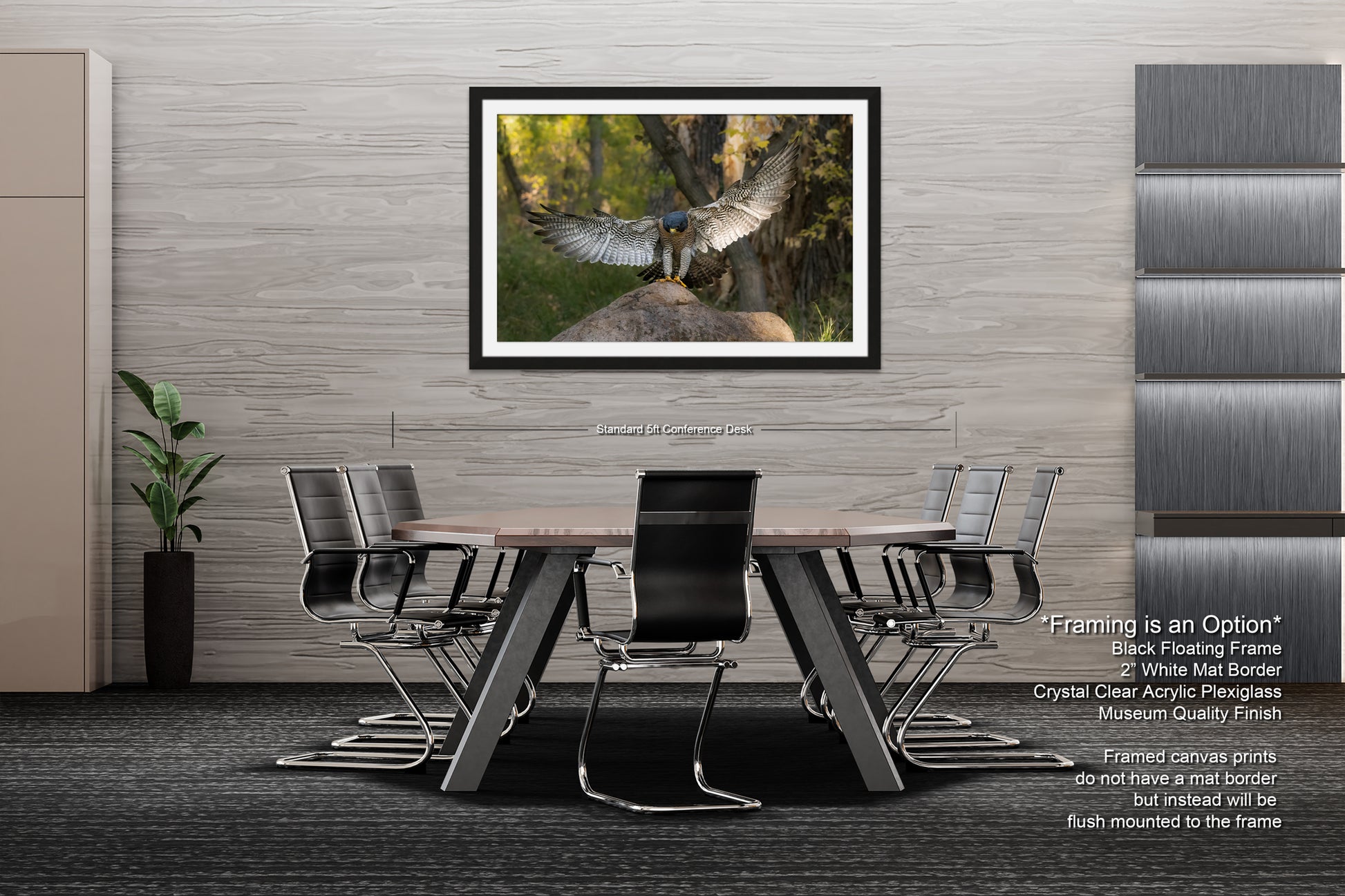 a modern office space with a large framed photograph of a bird in flight hanging on the wall above a wooden table surrounded by black chairs.