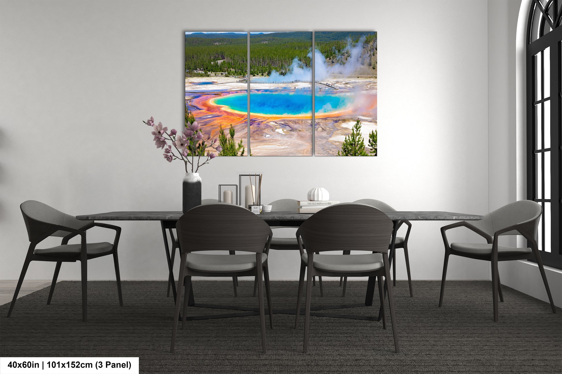 a dining room table with chairs and a painting on the wall