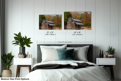 a bedroom with a bed and two pictures on the wall