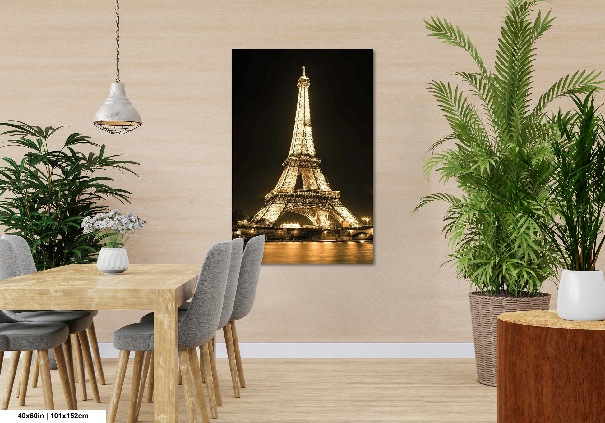 a room with a table and chairs and a painting of the eiffel tower