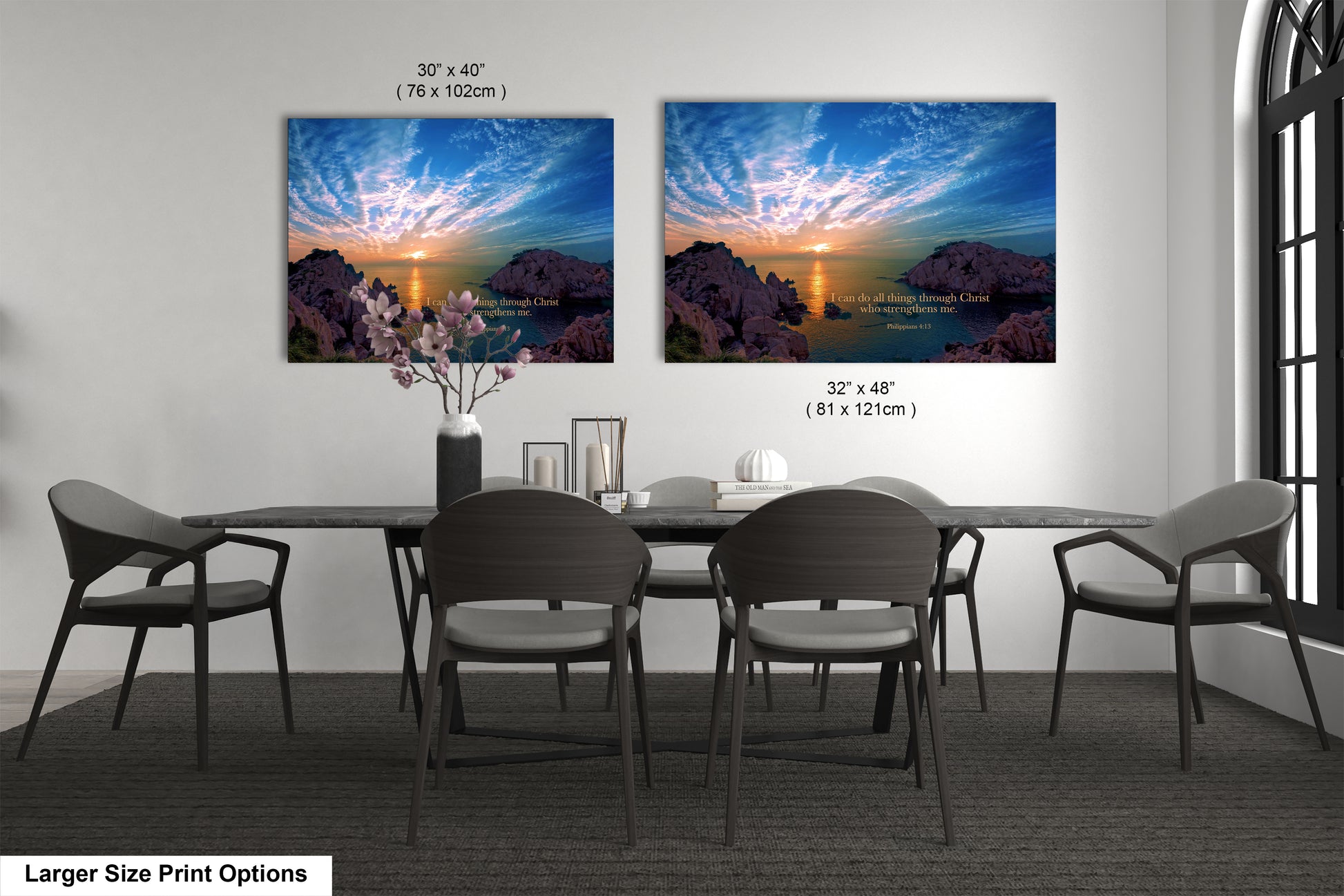 a dining room table with four chairs and two pictures on the wall