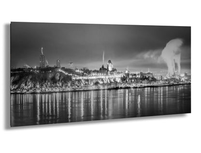 a black and white photo of a city at night