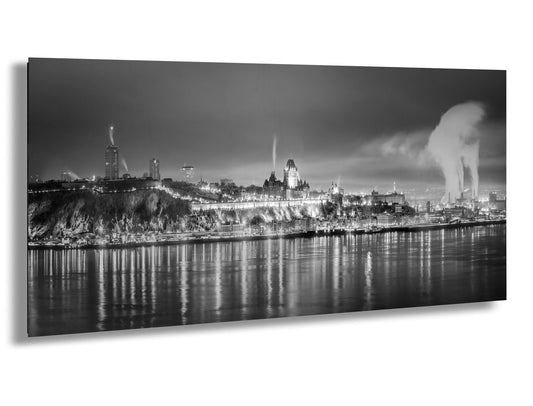 a black and white photo of a city at night