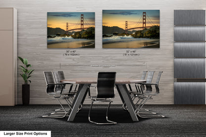 a dining room table with chairs and a picture of the golden gate bridge