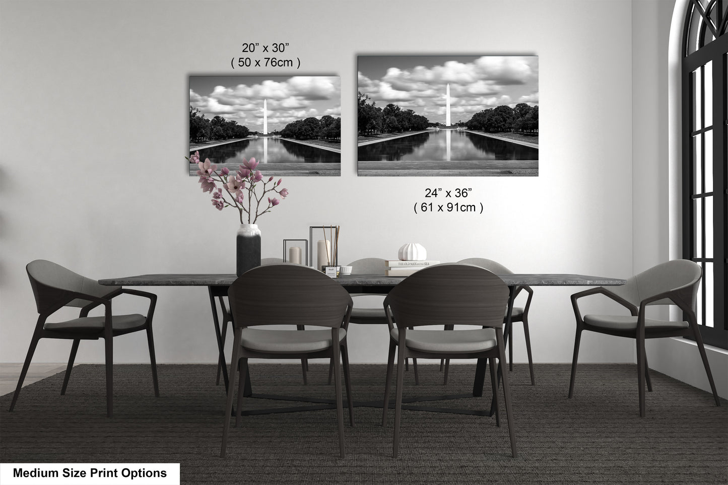 a dining table with four chairs and a vase of flowers