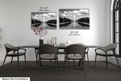 a dining table with four chairs and a vase of flowers