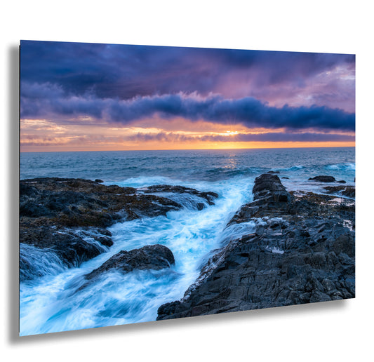 a picture of a sunset over the ocean