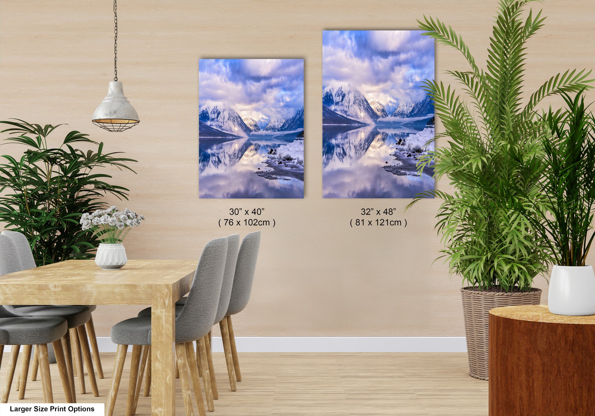 a room with a table and chairs and two pictures on the wall