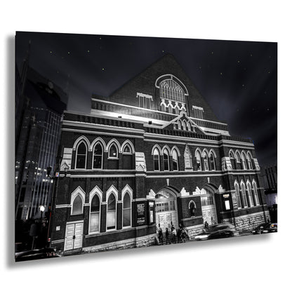 a black and white photo of a building at night