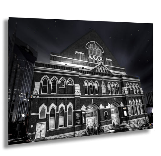 a black and white photo of a building at night