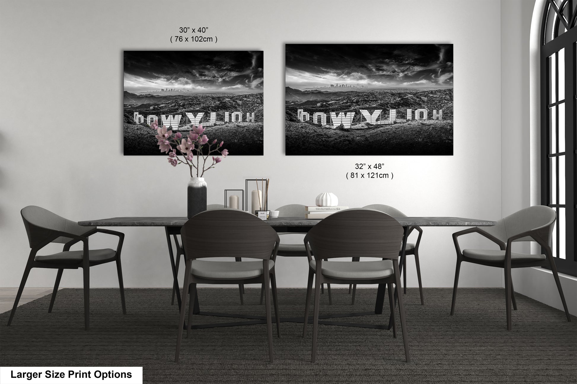 a black and white photo of a table and chairs