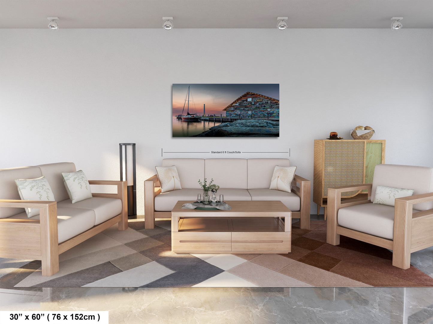A modern living room with a large painting of a boat on the wall, a sofa, a coffee table, and a potted plant.