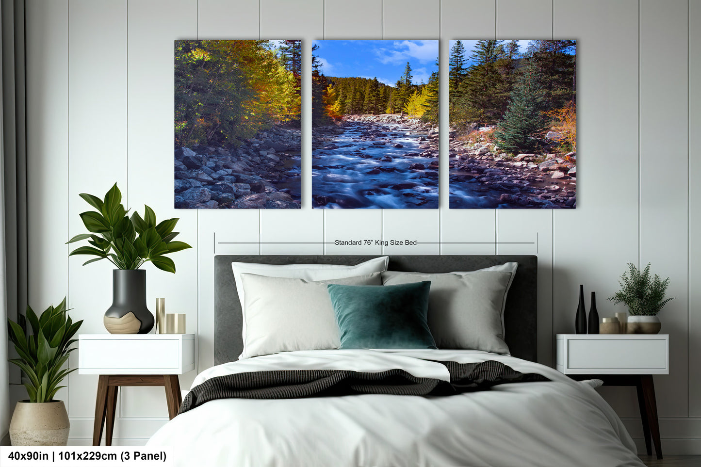 a bedroom with a bed and two paintings on the wall