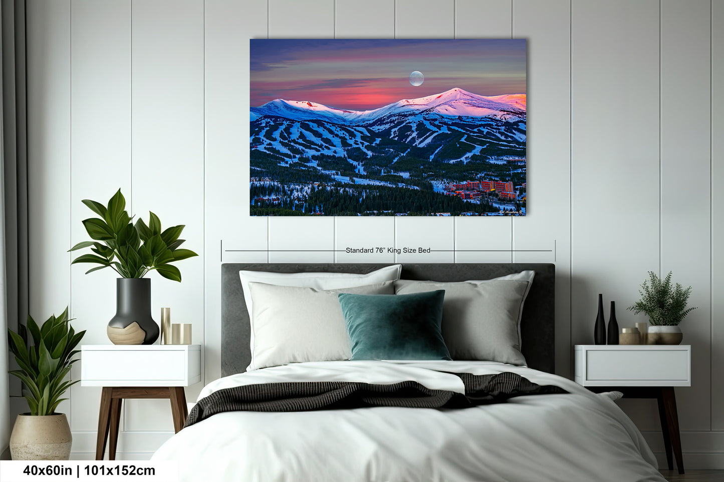 a bedroom with a bed and a painting on the wall