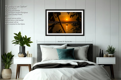 a bedroom with a bed and a picture on the wall