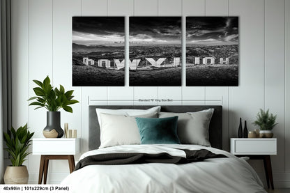 a black and white photo of a bed with pillows