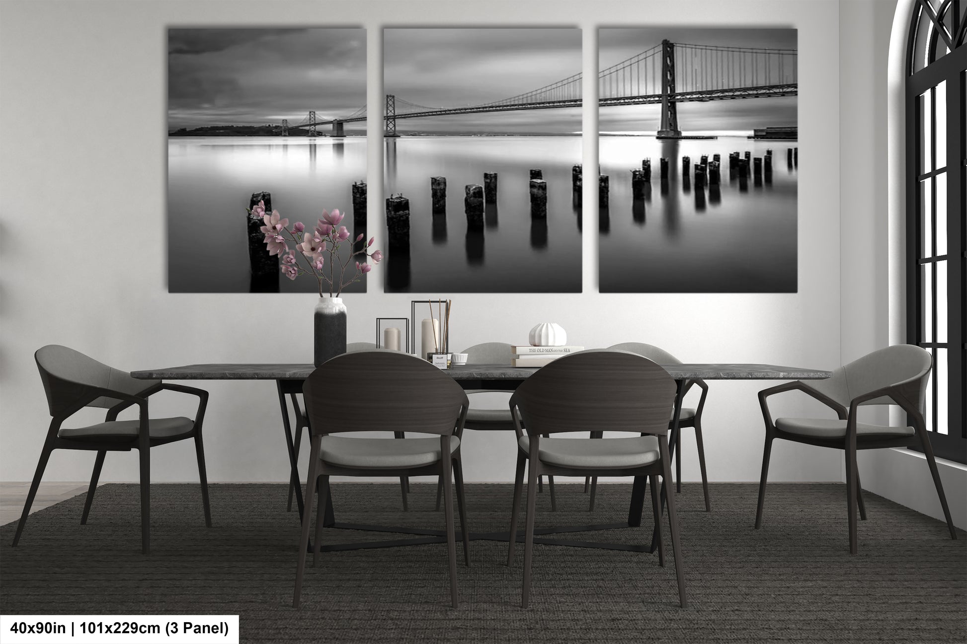 a black and white photo of a dining room table