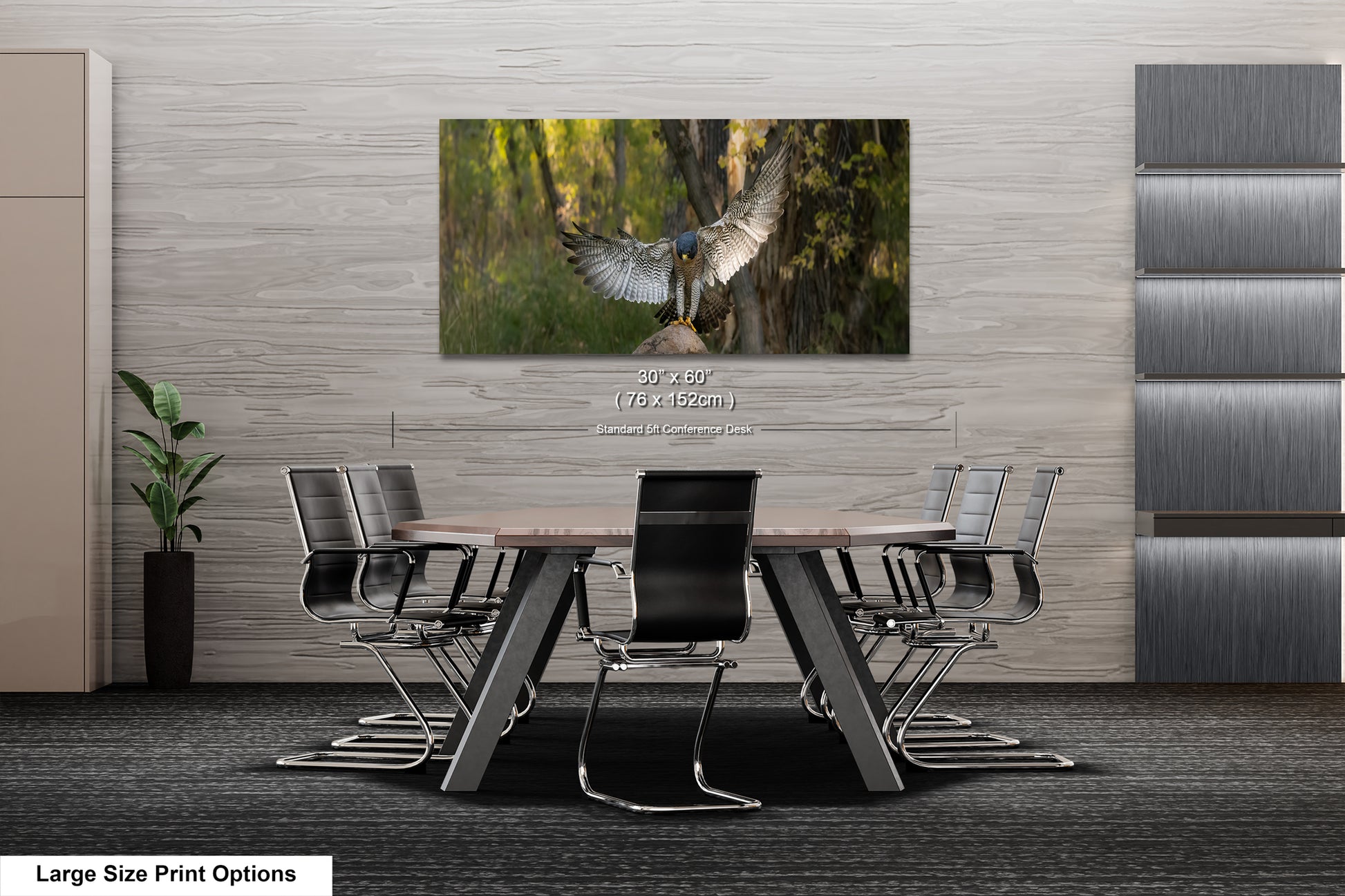 A modern office space with a large framed photograph of a bird in flight hanging on the wall above a wooden table surrounded by chairs.
